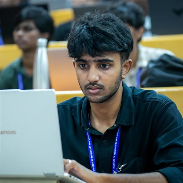 Student coding on a laptop