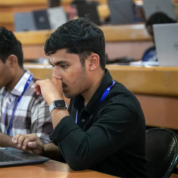 Students working on laptops in a lecture hall