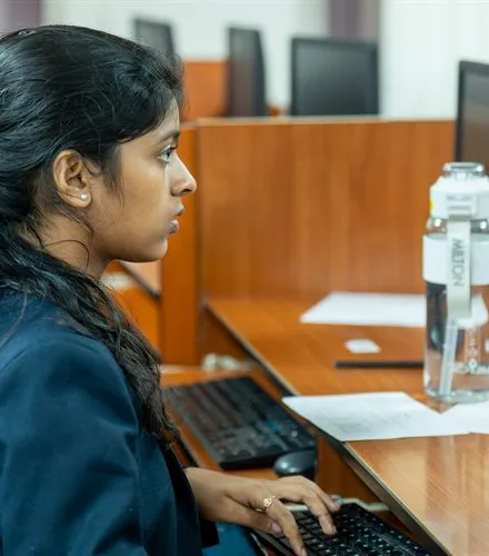 Student working at a computer in the lab